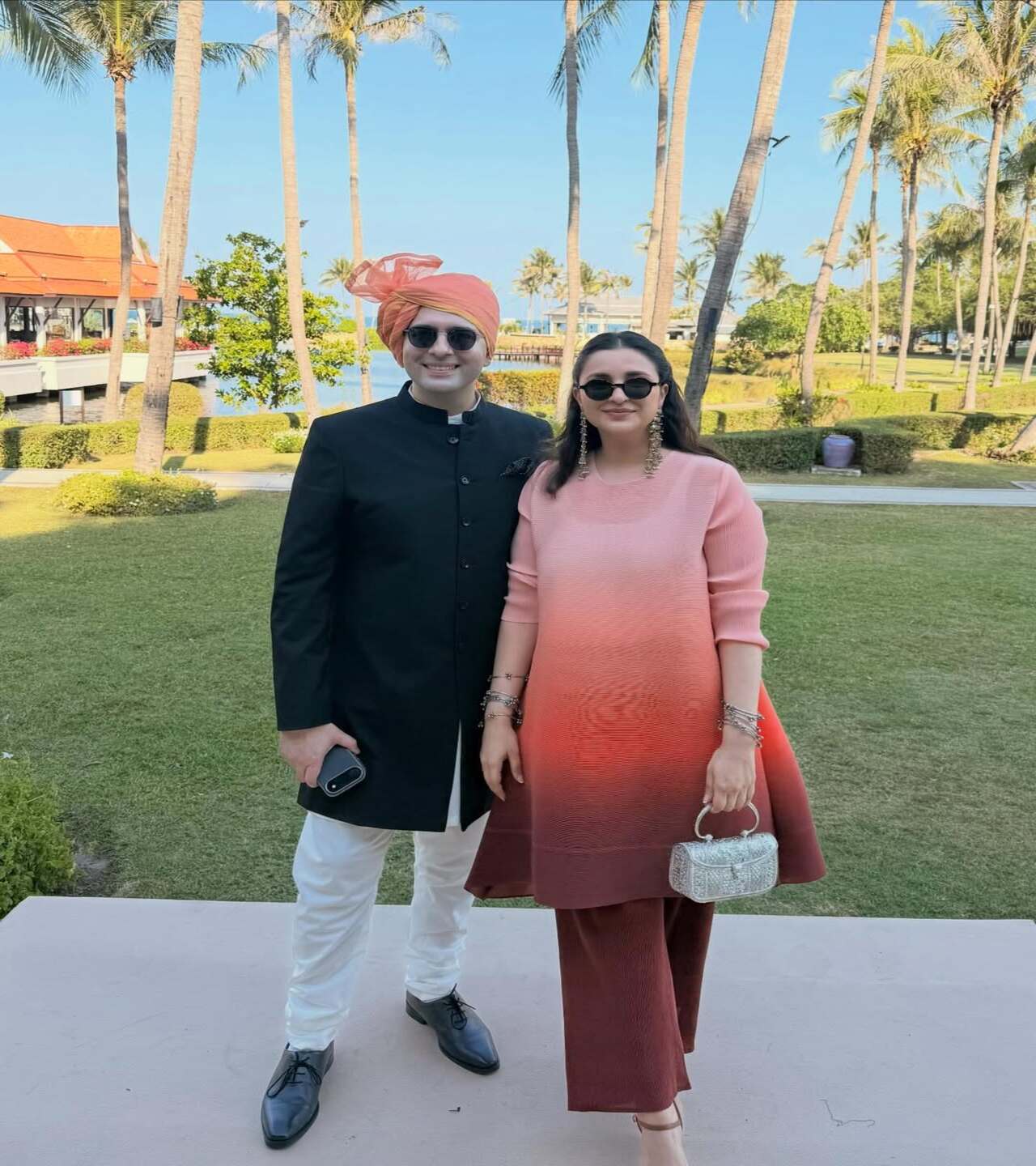 At a family wedding, Parineeti appeared in a multi-shaded ombre co-ord set, while Raghav opted for a black Jaipuri jacket paired with a white chudiar. He twinned with his wife in shades and a pink turban